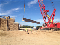 The installation of girders for the I-210 overpass over the future Cove Lane extension.