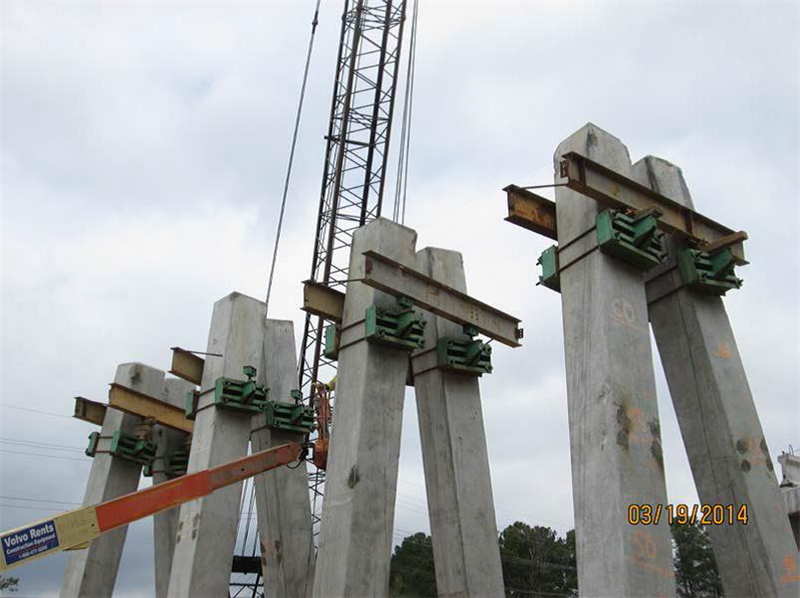 Installing support beams on friction collars for cap