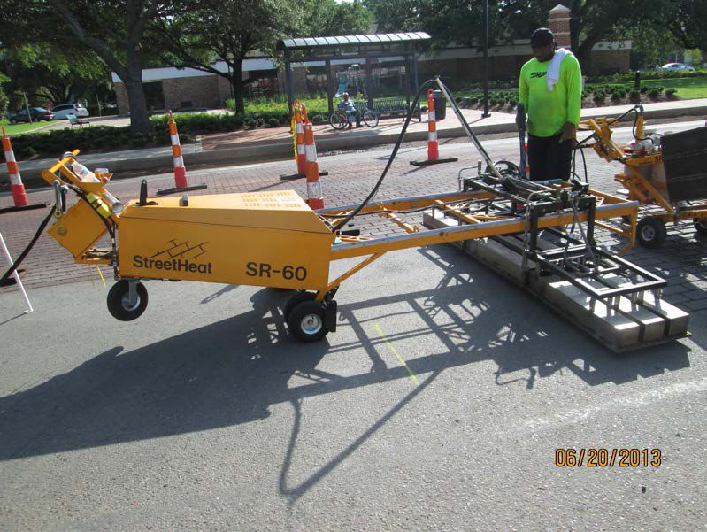 Using specialized pavement heaters to soften the existing hot mix