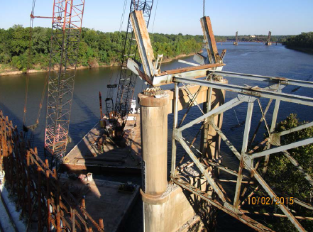 Removing small sections of steel from pier on the Pineville bank.