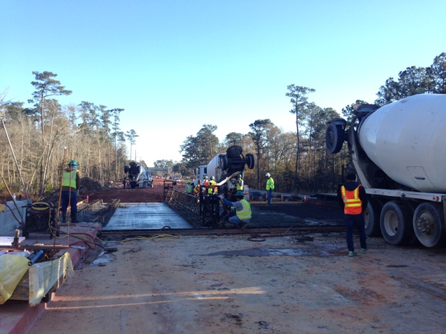 Workers pouring northern approach slab for the southbound bridge.
